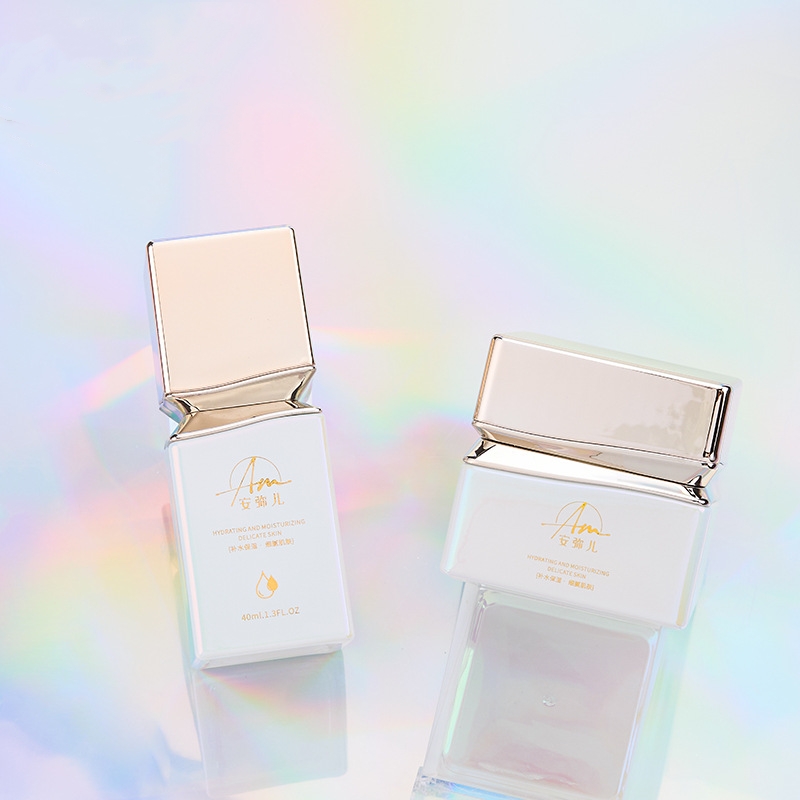 Firkantet glasskremkrukke med iriserende effekt for ansiktskrem og øyekrem Firkantet glasskremkrukke med iriserende effekt for ansiktskrem og øyekrem